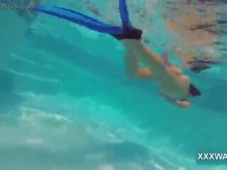 Glorious brunette slattern Candy swims underwater